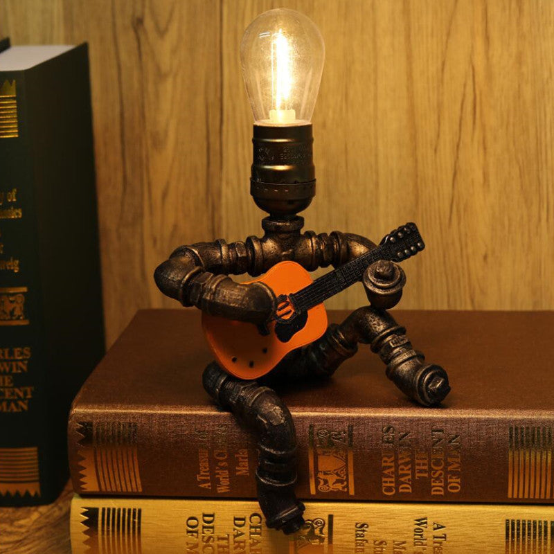 Retro lampa stołowa z gitarzystą, tworząca przytulną atmosferę | elesira