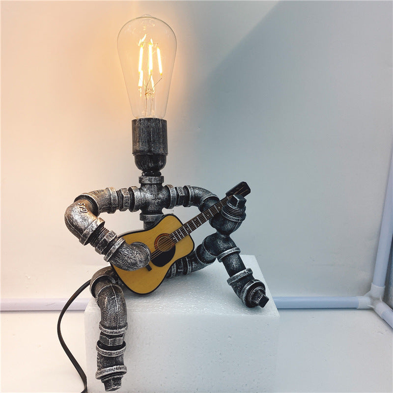 Retro lampa stołowa z gitarzystą, tworząca przytulną atmosferę | elesira