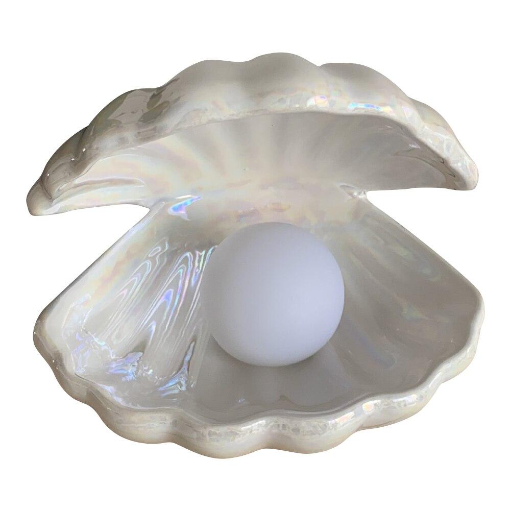 Lampada a conchiglia chic | Una lampada magica con perla | elesira