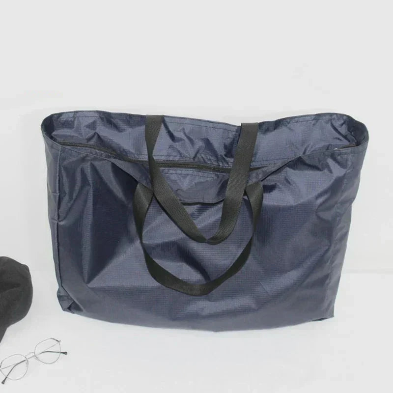 Wasserabweisende, faltbare Reisetasche – in 4 Größen erhältlich, Schwarz und Blau | elesira